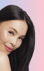 Woman with monolid eyes applying at-home DIY eyelash extensions