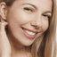 Woman with monolid eyes applying at-home DIY eyelash extensions