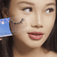 Asian woman with hooded eyelids wearing reuseable false eyelashes