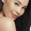 Asian woman with hooded eyelids wearing reuseable false eyelashes