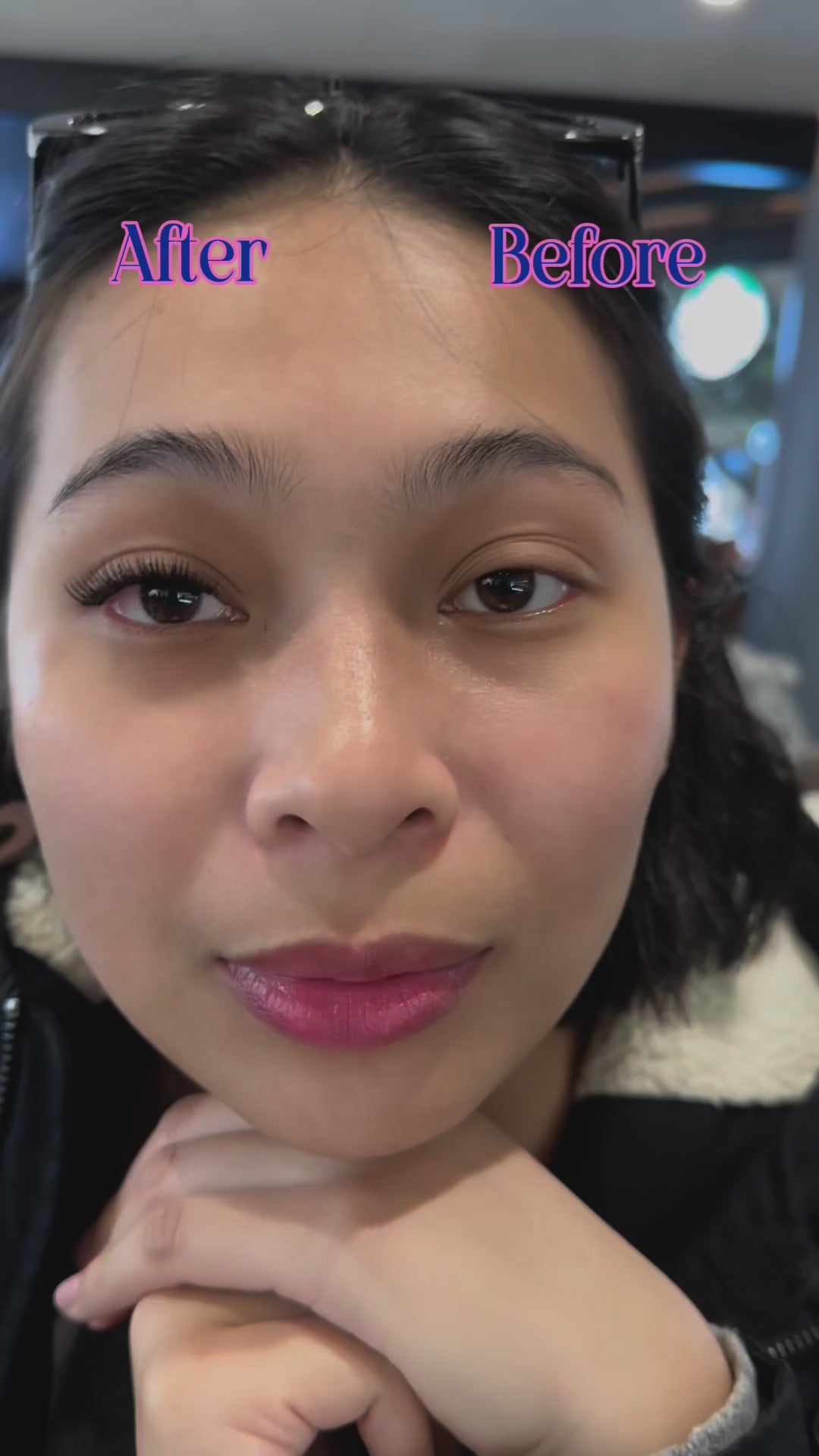 asian woman wearing lashes she applied herself at home