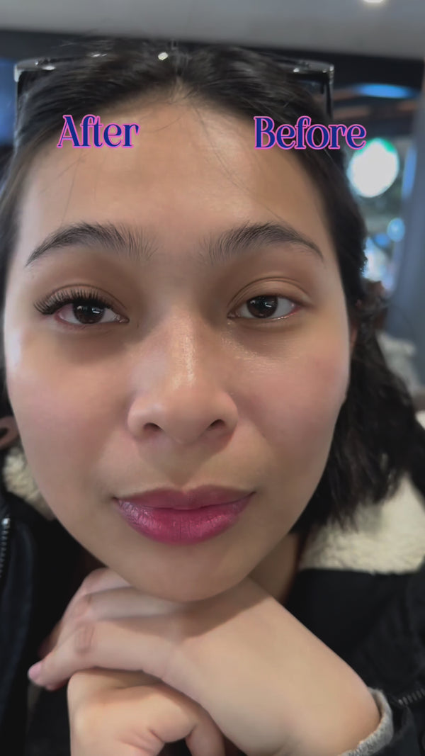 asian woman wearing lashes she applied herself at home