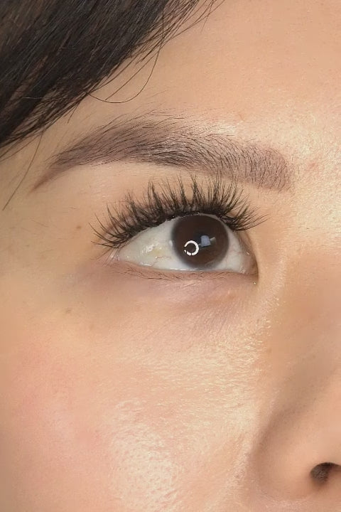 Korean woman with smaller eyes wearing natural-looking fake lashes 