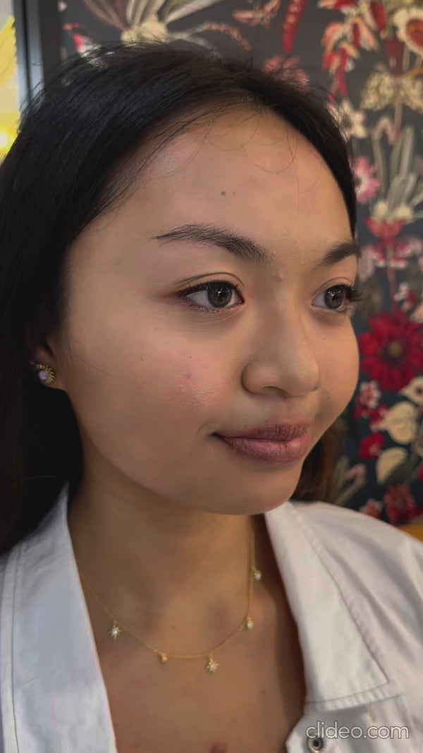 Asian woman with hooded eyelids wearing reuseable false eyelashes